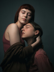 Obraz na płótnie Canvas Portrait of young passionate couple in love. Eyes closed. Studio