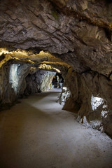 Underground Grotto Panorama.Types of a former underground marble quarry flooded with water. The massive arches of the grotto and the texture of natural marble are visible. Russia, Karelia, Ruskeala