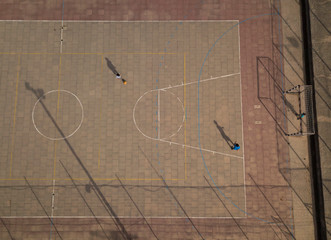 Aerial top down shot of kids playing soccer