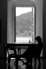 Silhouette of pregnant woman in her bedroom