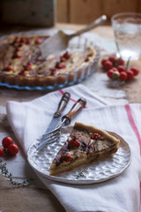 Pie stuffed with vegetables, cottage cheese and cream on a wooden background. Rustic style.