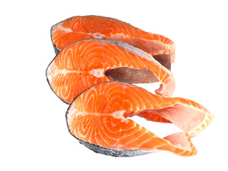 Three salmon steaks isolated on a white background