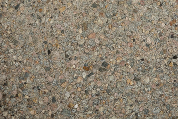 Gros plan texture b&eacute;ton d&eacute;sactiv&eacute; avec graviers gris, noir et couleur