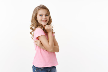 Tender lovely carefree young girl student kid, smiling silly laughing, posing delighted and...
