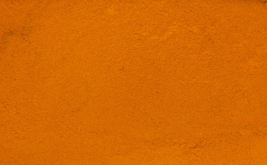Turmeric spice making a background pattern
