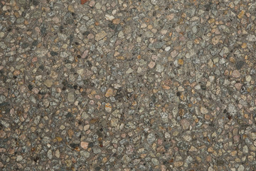 Naklejka premium Gros plan texture béton désactivé avec graviers gris, noir et couleur