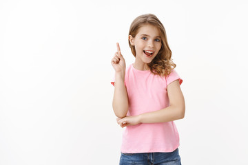 Creative smart good-looking blond little girl student raise index finger, answer question in school...