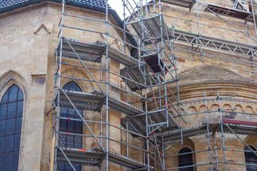 Scaffolding near the old cathedral installed for reconstruction and repair