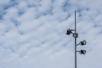 party lights on a stand against an empty sky