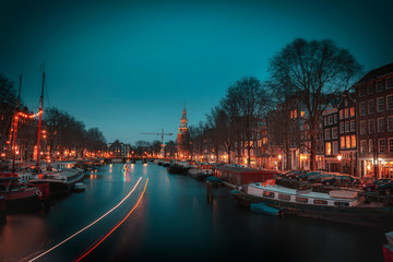 Fototapeta premium Old Flats in a line from Amsterdam With Trendy Colors During Twilight