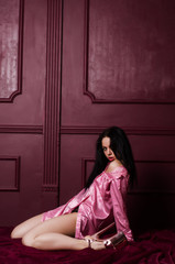 Fototapeta premium Young beautiful woman in a fashionable linen luxury brunette in the Studio