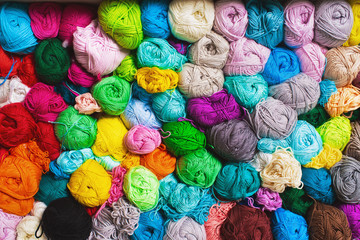 Fototapeta na wymiar Сrocheting and knitting. Colorful multicolored skeins of yarn.Women's hobby. Vertical