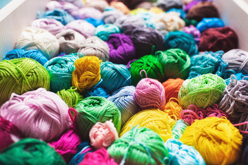 Fototapeta na wymiar Сrocheting and knitting. Colorful multicolored skeins of yarn.Women's hobby. 