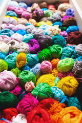 Сrocheting and knitting. Colorful multicolored skeins of yarn.Women's hobby.  Vertical