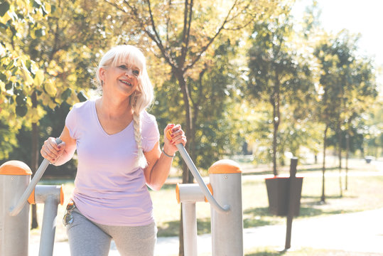 Senior woman exercising in park