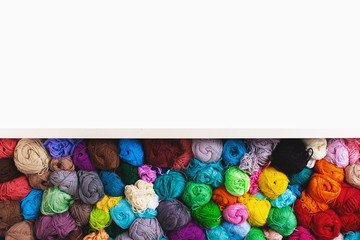 Сrocheting and knitting. Colorful multicolored skeins of yarn in the box on a white background. Women's hobby.