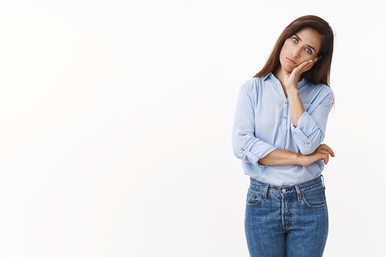 Gloomy Sad Caucasian Female Housewife Troubled, Stand Uneasy Lean On Tattooed Hand, Look Annoyed Tired, Drained Working Late, Stare Bored Indifferent Camera, Stand White Background Irritated