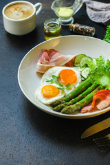 healthy breakfast (fried eggs, bacon, vegetables, asparagus beans, coffee and more) menu concept. food background. copy space. Top view