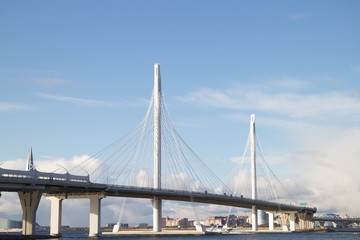 Cable-stayed bridge over a large river on a sunny day