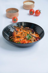 Eggplant, pepper and carrot salad. Korean eggplant salad. White background. . Vegetarianism. View from above. Copy space. Flat lay.