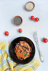 Eggplant, pepper and carrot salad. Korean eggplant salad. White background. . Vegetarianism. View from above. Copy space. Flat lay.