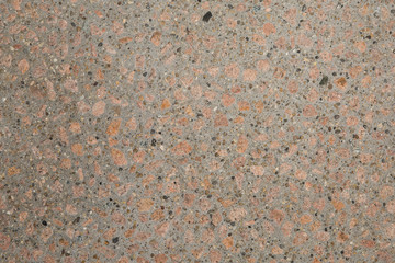 Texture béton désactivé en gros plan avec graviers blanc clair et gris foncé et couleur