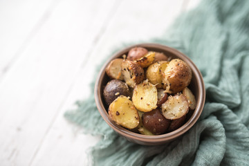 Delicious Roasted mini potato with spices and Parmesan cheese, cut in halves