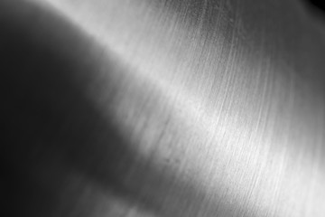 Abstract metal macro background with selective focus. Silver metallic texture, close-up