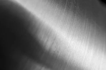 Fotobehang Abstracte metalen macro achtergrond met selectieve aandacht. Zilver metallic textuur, close-up © Olha Kozachenko
