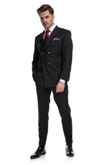 confident young businessman wearing double breasted suit