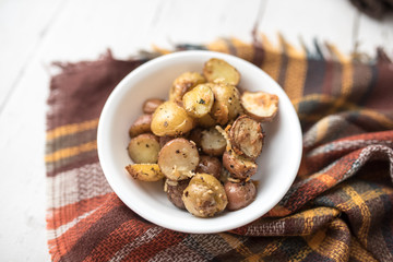 Delicious Roasted mini potato with spices and Parmesan cheese, cut in halves
