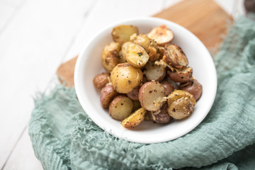 Delicious Roasted mini potato with spices and Parmesan cheese, cut in halves