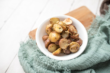 Delicious Roasted mini potato with spices and Parmesan cheese, cut in halves