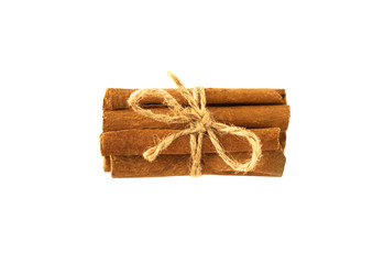 Top view of bunch of cinnamon sticks tied with rope and isolated on white background