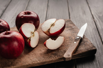 Peel and sliced apples on a kitchen board