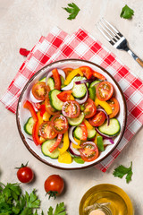 Vegetable salad on light table top view.