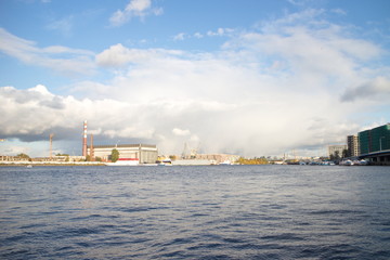 Fototapeta premium River landscape in the city on a sunny day