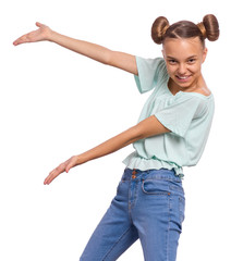 Portrait of teen girl presenting something while smiling for camera, isolated on white background. Emotions and signs concept. Child showing empty copy space.