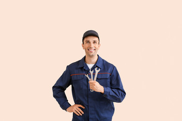 Obraz na płótnie Canvas Male car mechanic on color background