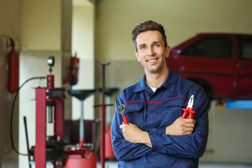 Male mechanic in car service center