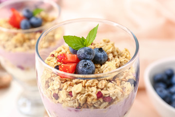 Dessert with blueberry and oat flakes in glass, closeup