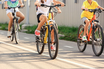 Fototapeta premium Happy family riding bicycles outdoors