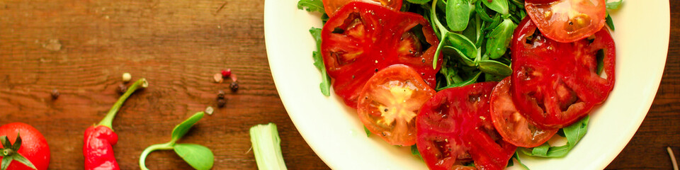 healthy salad tomatoes (vegetables, onions, greens, lettuce, sunflowers, microgreens and more) menu concept. food background. copy space. Top view