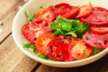 healthy salad tomatoes (vegetables, onions, greens, lettuce, sunflowers, microgreens and more) menu concept. food background. copy space. Top view