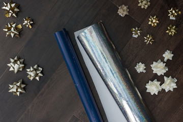 wrapping paper on floor Christmas  festive time with bows silver gold abstract