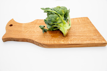 Organic broccoli fresh from garden cutting prepare for cook on cutting board .Healthy food, Green vegetable.Copy space