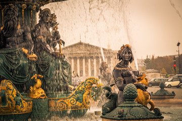 Fountain of River Commerce and Navigation in Place de la Concorde in Paris France, on a Fall day, with drops of water falling from the golden fountain