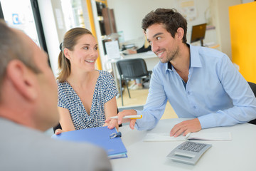happy couple is accepting a loan