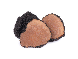 Black truffles isolated on a white background. Fresh sliced truffle. Delicacy exclusive truffle mushroom. Piquant and fragrant French delicacy. Clipping path.