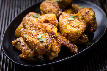 Spicy chicken wings with garlic and lemon marinade